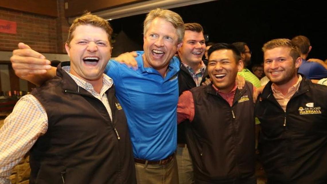 Dr. Roger Marshal, second left, and his campaign staff celebrate as they find out that he won McPherson County during a watch party Tuesday, Aug. 2, 2016, in Great Bend, Kan. Marshall defeated Republican Rep. Tim Huelskamp by a 14-point margin, taking down one of the most prominent conservative rebels on Capitol Hill.