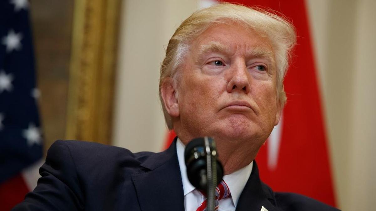 President Donald Trump listens as Turkish President Recep Tayyip Erdogan speaks in the Roosevelt Room of the White House.