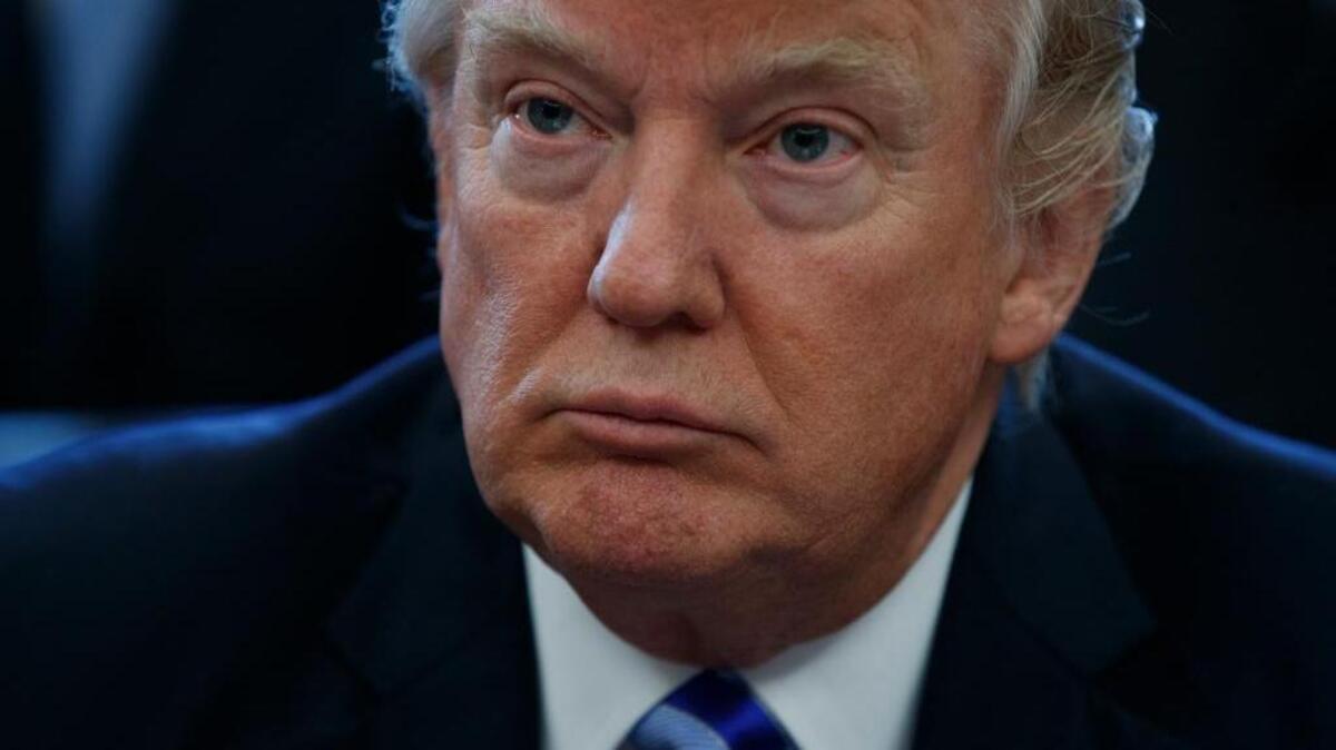 President Donald Trump pauses in the Oval Office of the White House in Washington Friday, March 24, 2017, during an announcement on the approval of a permit to build the Keystone XL pipeline, clearing the way for the $8 billion project.