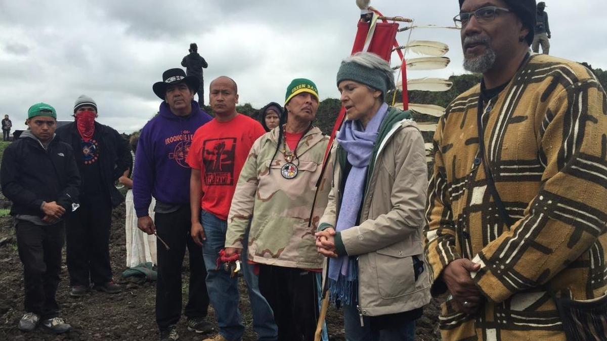 Green Party presidential candidate Jill Stein, second from right, participates in an oil pipeline protest on Tuesday, Sept. 6, 2016 in Morton County, N.D.