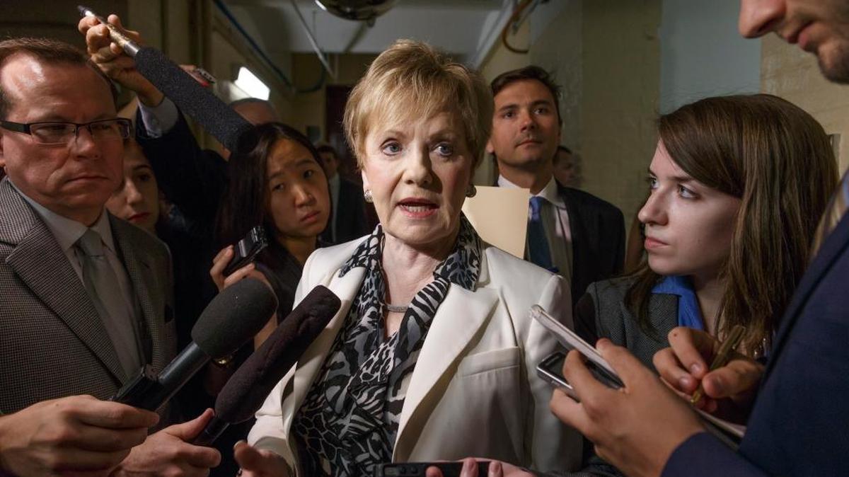 Rep. Kay Granger of Texas is surrounded by reporters on Capitol Hill in Washington on July 25, 2014, as she emerges from a closed-door session with fellow Republicans.