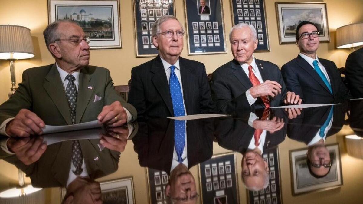 From left, Senate Judiciary Committee Chairman Chuck Grassley, R-Iowa, Senate Majority Leader Mitch McConnell, R-Ky., Senate Finance Committee Chairman Orrin Hatch, R-Utah, and Treasury Secretary Steven Mnuchin, make statements to reporters as work gets underway on the Senate's version of the GOP tax reform bill.