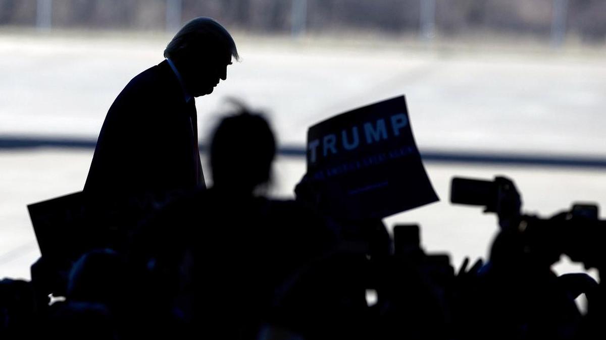 Republican presidential candidate Donald Trump steps to the microphone before speaking at a rally Saturday in Bentonville, Ark. Former Mexican President Felipe Calderon on Saturday joined his predecessor in office in unloading on Donald Trump, calling the Republican front-runner’s campaign racist and saying his discourse on immigration is fueling anti-American sentiment around the world.