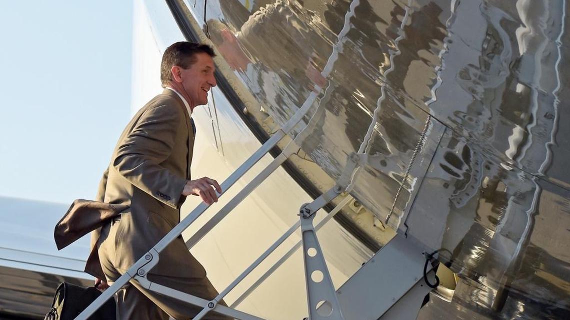 In this Feb. 12, 2017, photo, then-National Security Adviser Michael Flynn boarded Air Force One at Palm Beach International Airport in West Palm Beach, Fla., as he returned to Washington with President Donald Trump. Flynn resigned the next day.