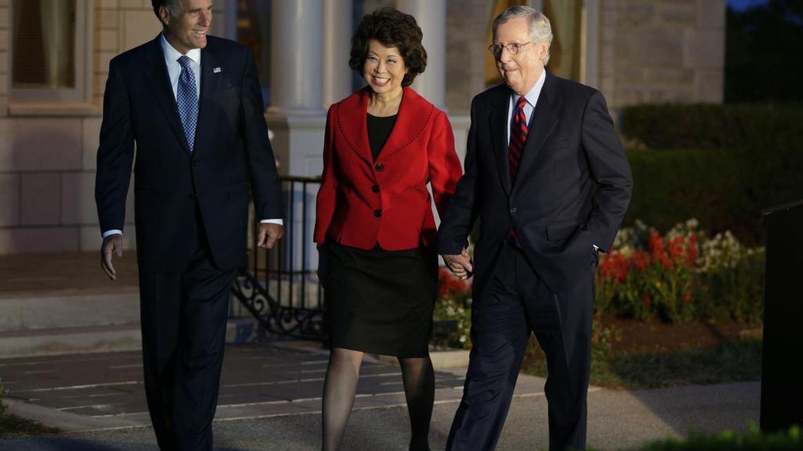 Kentucky Sen. Mitch McConnell , right, held a press conference with his wife, Elaine Chao, and Mitt Romney at Donamire Farm on Thursday October 2, 2014 in Lexington, Ky.