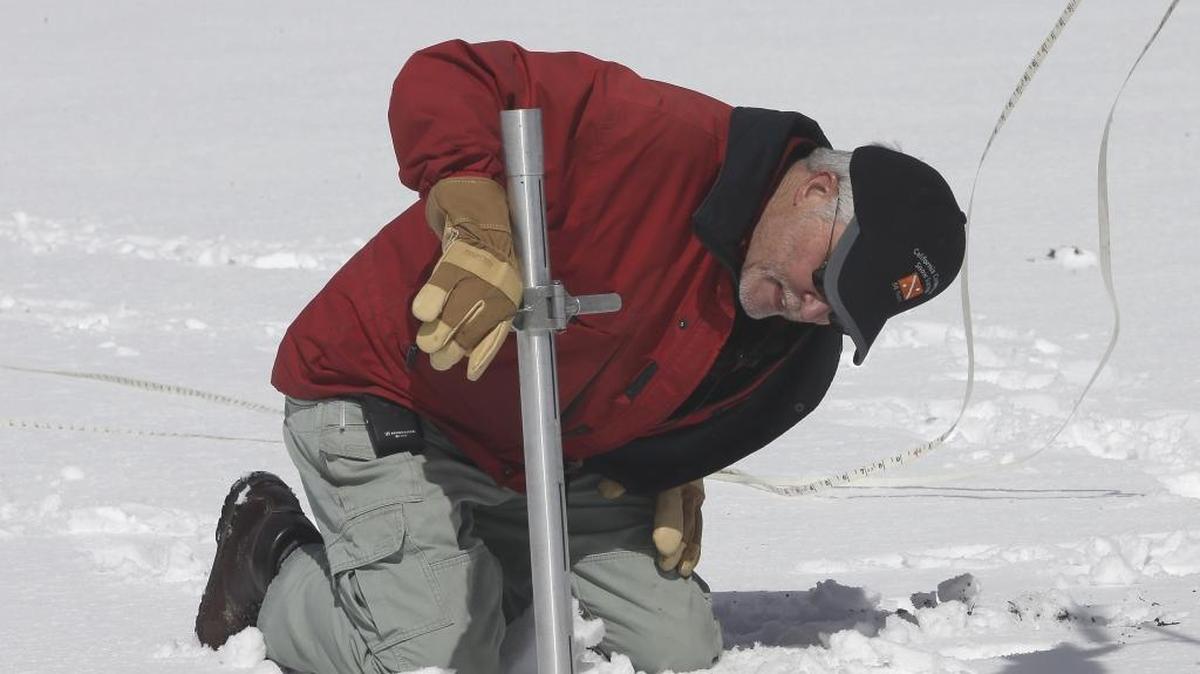 Frank Gehrke, chief of the California Cooperative Snow Surveys Program for the Department of Water Resources, checks the snowpack depth while performing a snow survey near Echo Summit, Calif., on March 30, 2016. The survey showed the snowpack at about 95 percent of normal for this site at that time of year.