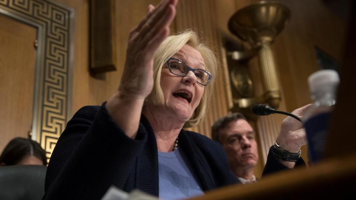 Senate Finance Committee member Sen. Claire McCaskill, D-Mo., joined by Sen. Mark Warner, D-Va., right, challenges Treasury Secretary-designate Steven Mnuchin about policies of his future boss, President-elect Donald Trump, Thursday, Jan. 19, 2017, during his confirmation hearing before the committee.