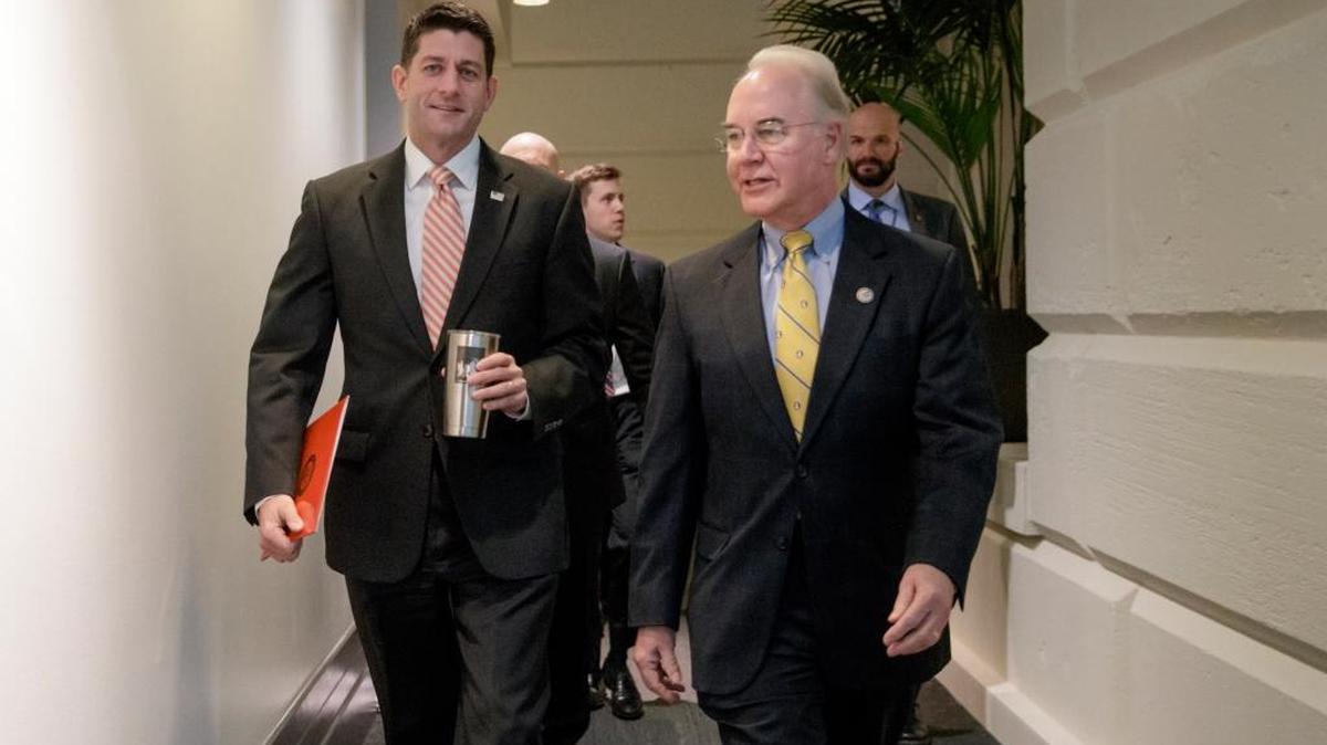 FILE - In this Jan. 31, 2017 file photo, House Speaker Paul Ryan, R-WI, arrives on Capitol Hill with Health and Human Services Secretary Tom Price for a closed-door GOP strategy session on health care. The Congressional Budget Office just released a new report on the cost and impact of the revised GOP legislation to repeal and replace the Affordable Care Act. (AP Photo/J. Scott Applewhite)