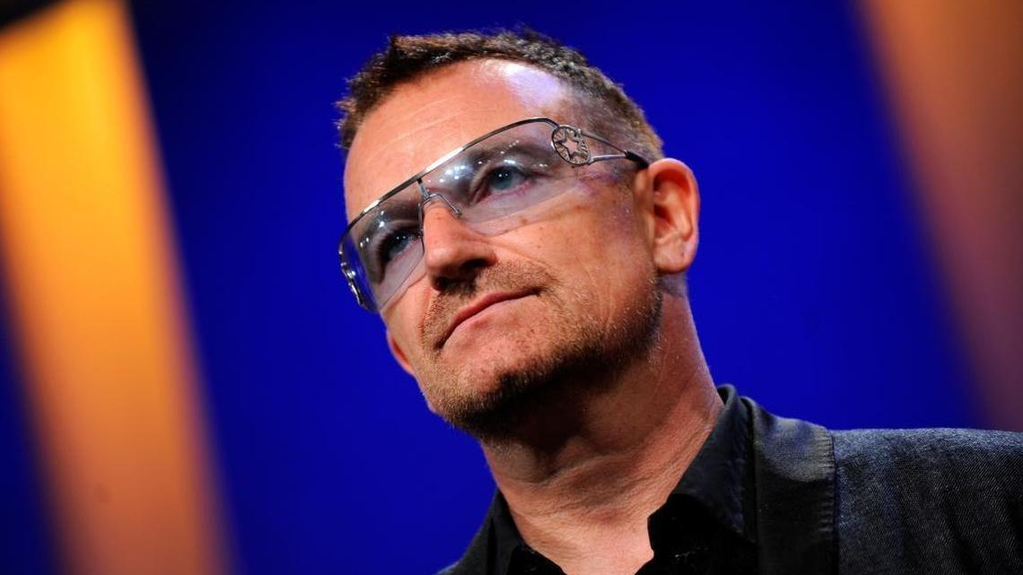 U2’s Bono accepted a Glamour Women of the Year award Monday night and addressed criticism of the magazine giving the award to a man.