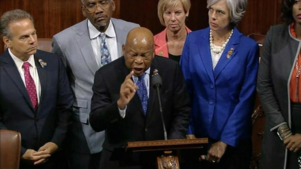 In this frame grab taken from AP video Georgia Rep. John Lewis leads more than 200 Democrats in demanding a vote on measures to expand background checks and block gun purchases by some suspected terrorists in the aftermath of last week's massacre in Orlando, Florida, that killed 49 people in a gay nightclub. Rebellious Democrats shut down the House's legislative work on Wednesday, June 22, 2016, staging a sit-in on the House floor and refusing to leave until they secured a vote on gun control measures before lawmakers' weeklong break.
