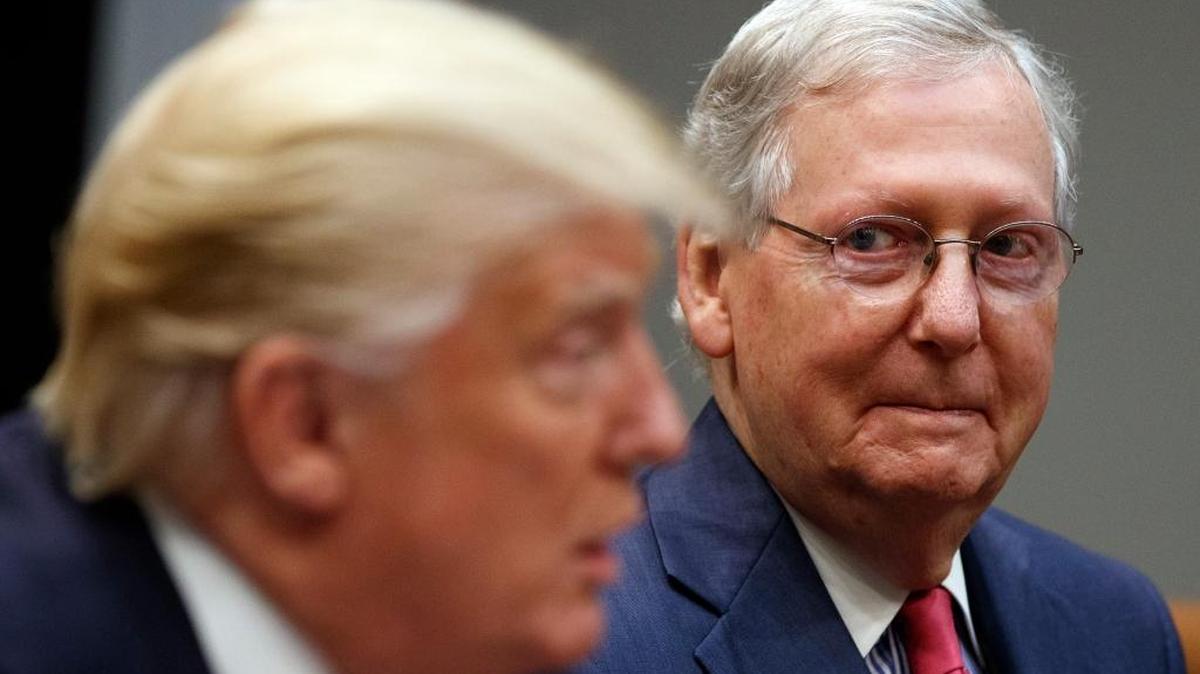 Senate Majority Leader Mitch McConnell, R-Ky., right, listens as President Donald Trump speaks during a meeting with Congressional leaders and administration officials on tax reform, in the Roosevelt Room of the White House, Tuesday, Sept. 5, 2017, in Washington.