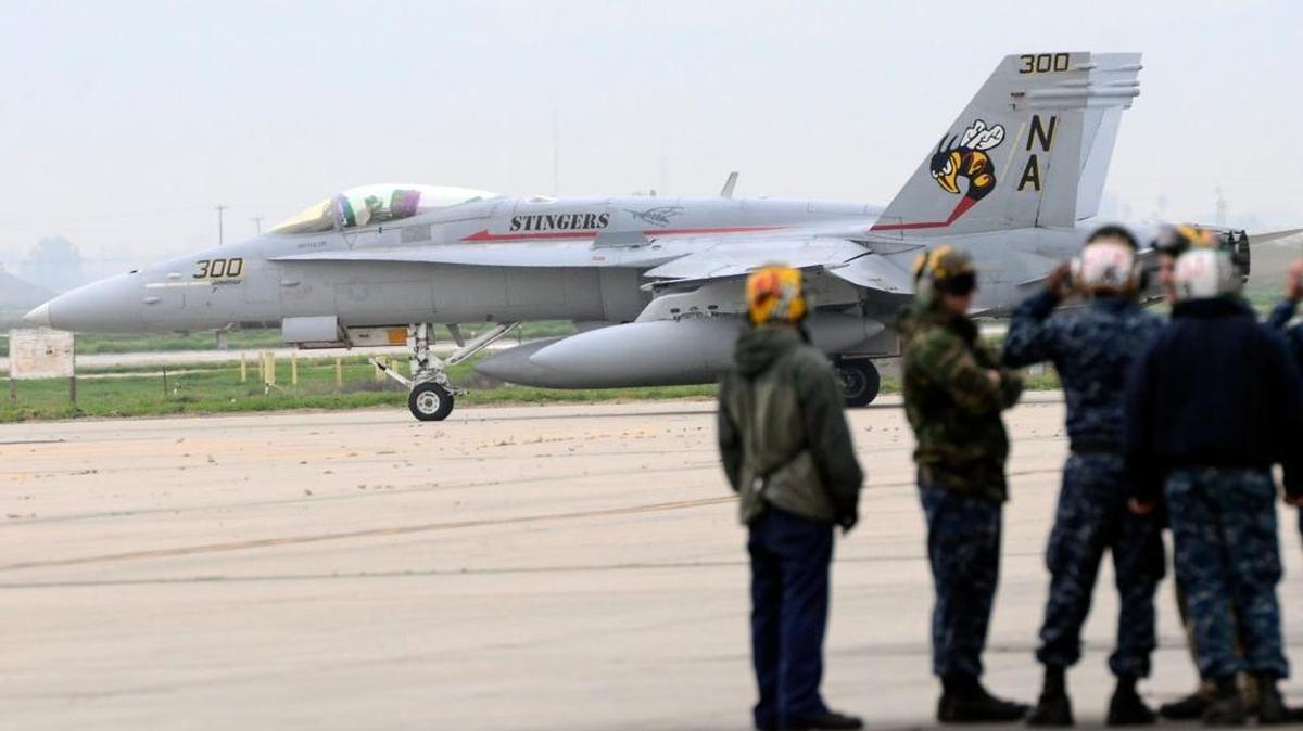 The flight crew stands by for the last F/A-1C Hornet flight out of Naval Air Station Lemoore on Feb. 17, 2016. It is being replaced by the F-35 Joint Strike Fighter.