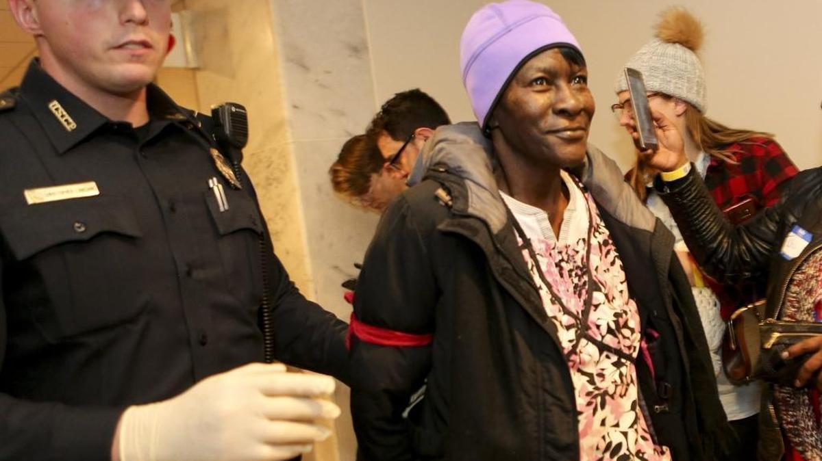 Alice Allen of Missouri, 67, who is semi-retired, is arrested in the Hart Senate Building during a protest against the repeal of the Affordable Care Act in Washington, D.C., on Tuesday, Jan. 31, 2017. A group made up of health care workers, people with pre-existing conditions and faith leaders let themselves be arrested on Capitol Hill to register dissent to Republicans' plans to repeal the Affordable Care Act, also known as Obamacare. About 50 people from 20 states were arrested for breaking the law against protesting in a Senate office building.