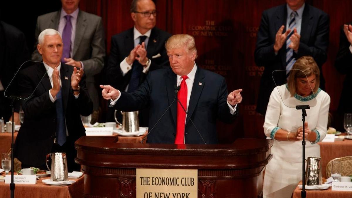 Republican presidential candidate Donald Trump speaks to the Economic Club of New York on Thursday, Sept. 15, 2016, in New York. Republican vice presidential candidate Mike Pence applauds at left.