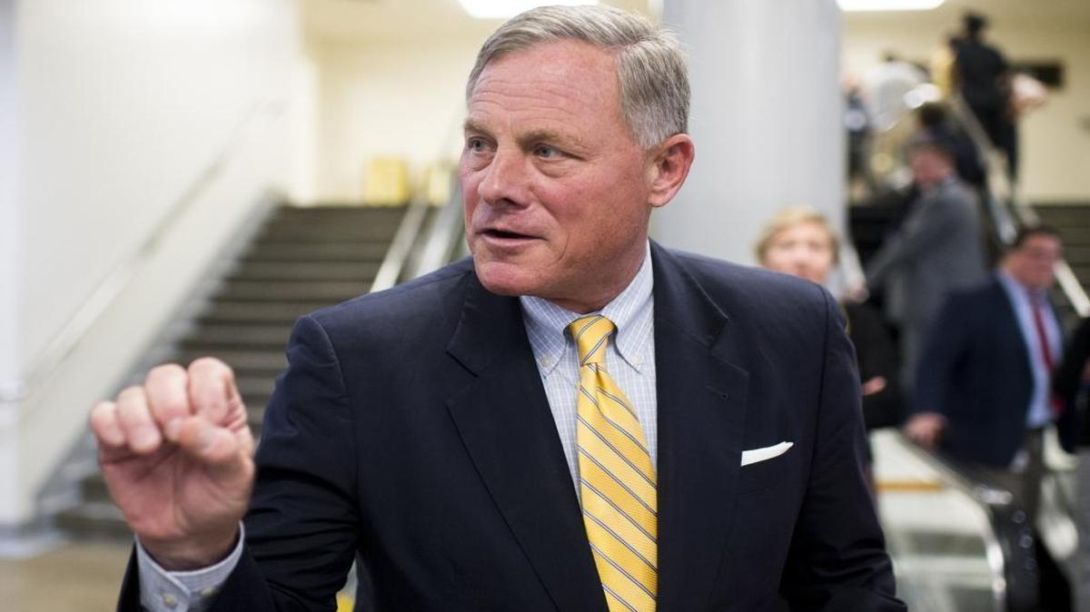 FILE – Sen. Richard Burr, R-N.C., speaks with a reporter on Thursday, Sept. 15, 2016 as he leaves the Capitol following a vote. On Monday, Burr said: “The Senate Select Committee on Intelligence has been, and remains, concerned about Russia’s actions.”