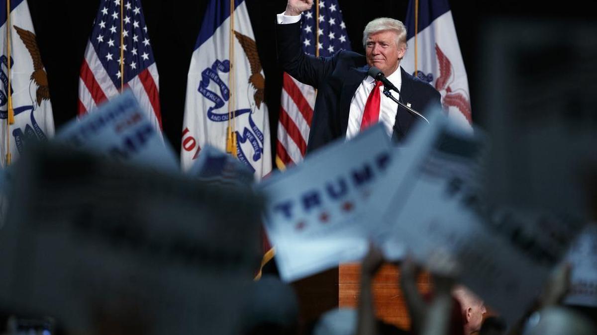 Republican presidential candidate Donald Trump pumps his fist during a campaign rally, Friday, Aug. 5, 2016, in Des Moines, Iowa. At a later rally in Green Bay, Wis., Trump endorsed House Speaker Paul Ryan after he earlier declined to do so.