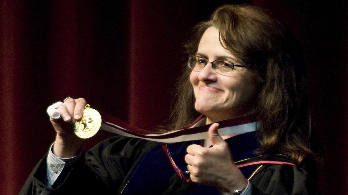 Former Texas A&M president Elsa Murano holds up a medallion after being formally named the university's 23rd president in 2008. Murano is one of three Texans who could become agriculture secretary under President-elect Donald Trump.