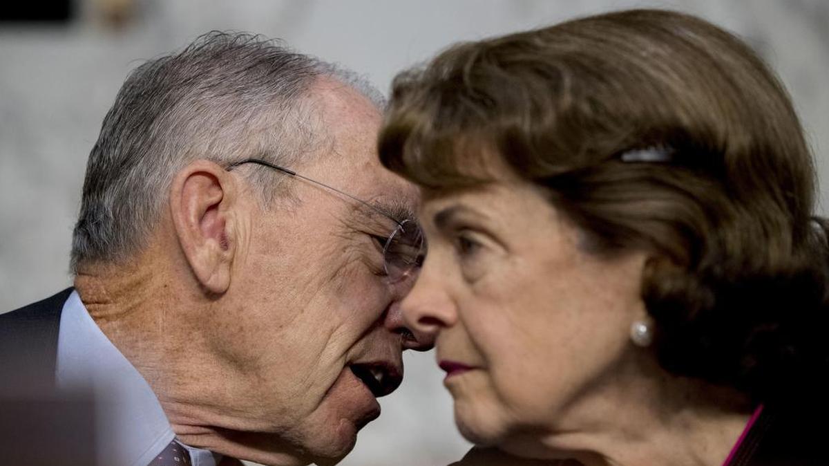 Chairman Sen. Chuck Grassley, R-Iowa, and Ranking Member Sen. Dianne Feinstein, D-Calif., talk during a Senate Judiciary Committee hearing in Washington, Tuesday, Oct. 3, 2017, on the Trump Administration's decision to end Deferred Action for Childhood Arrivals otherwise known as DACA. Feinstein and Grassley have clashed over whether he will continue to honor the “blue-slip” tradition of allowing senators veto judicial nominations that affect their home states.