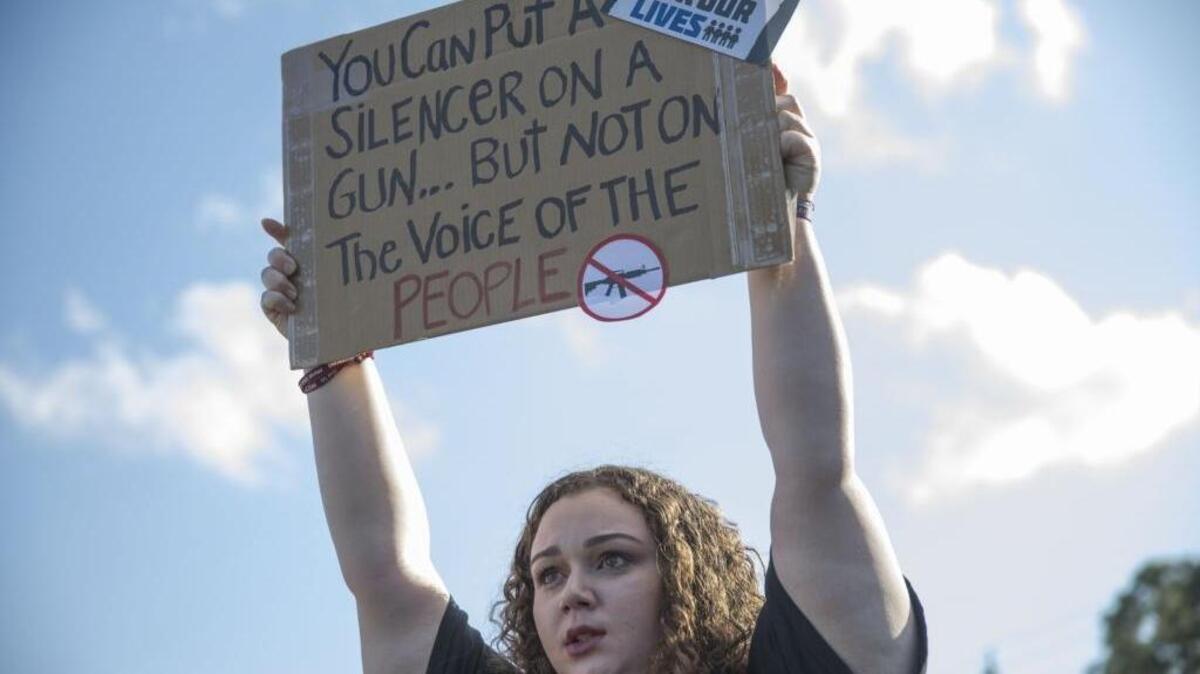Sophie Phillips holds a sign as she attends a rally for those heading to the March for Our Lives event in Washington D.C. on March 20, 2018 in Parkland, Florida. The rally was held in the name of the 17 students and school staff killed on Valentines Day at Marjory Stoneman Douglas High School.