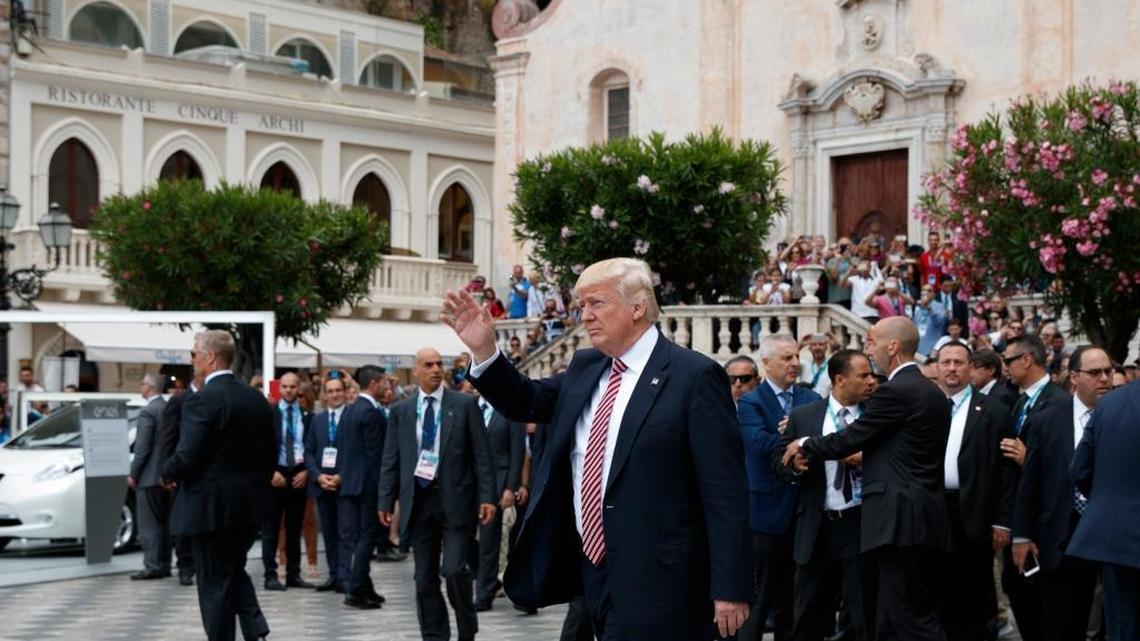 President Donald Trump waves as he takes a walking tour during the G-7 Summit, Friday, May 26, 2017, in Taormina, Italy.