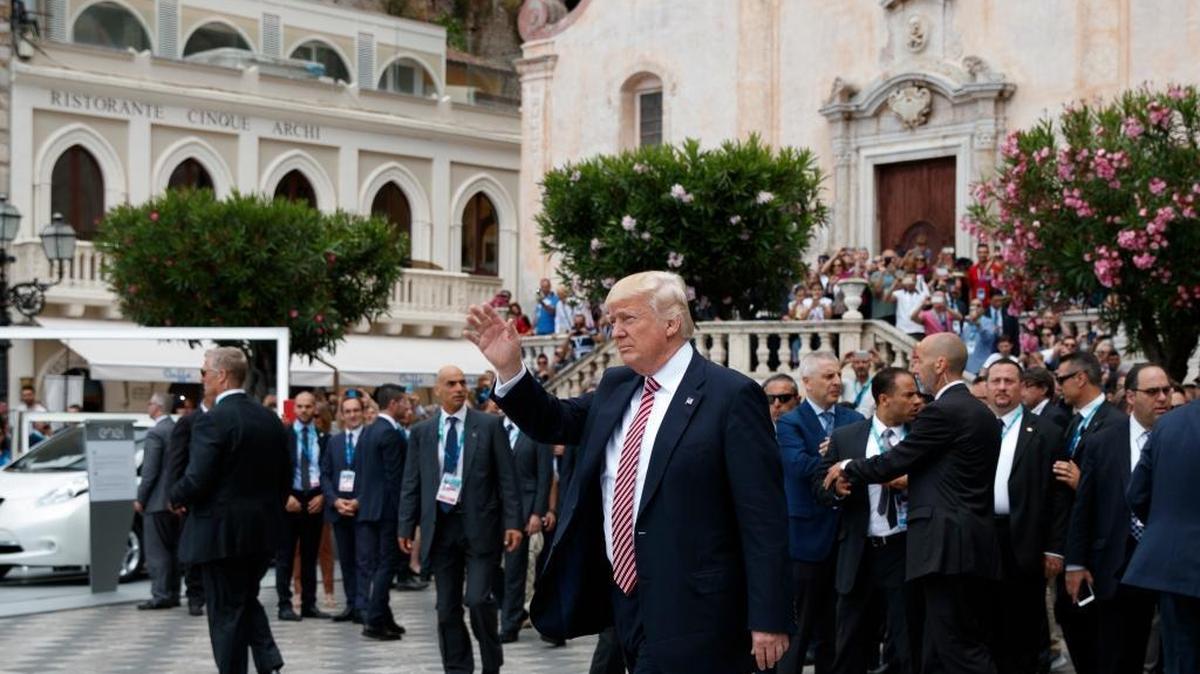 President Donald Trump waves as he takes a walking tour during the G-7 Summit, Friday, May 26, 2017, in Taormina, Italy.