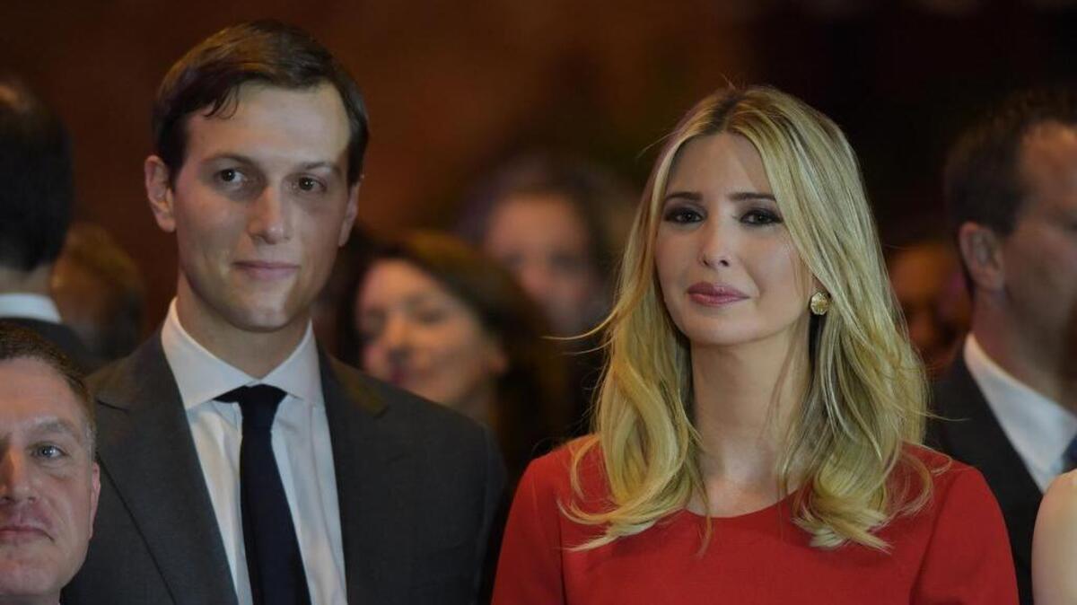 Jared Kushner and his wife, Ivanka Trump, listen to a speech.