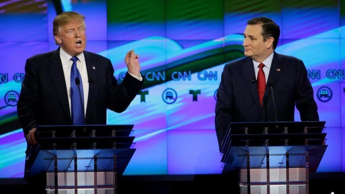 In this Feb. 25, 2016, file photo, Sen. Ted Cruz, R-Texas, listens as Donald Trump speaks during a Republican presidential primary debate at The University of Houston in Houston. Cruz announced Sept. 23 that he will vote for Trump, a dramatic about-face for the Texas senator, who previously called the New York businessman a "pathological liar" and "utterly amoral."