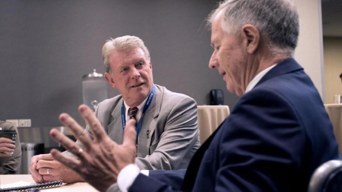 Idaho Gov. C.L. “Butch” Otter, left, discusses investment opportunities with Peter Collins, right, from Industry Super Australia at the SelectUSA investment summit in Washington, D.C., on June 20, 2016. Otter, one of three U.S. governors invited to speak at the third annual summit, came to Washington to seek more foreign investment for Idaho.