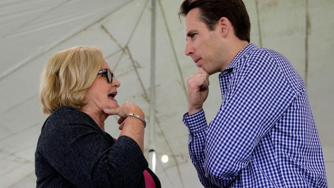 US. Sen. Claire McCaskill, D-Mo., talks with Missouri Attorney General and likely Republican challenger Josh Hawley during the Governor's Ham Breakfast at the Missouri State Fair in Sedalia, Mo