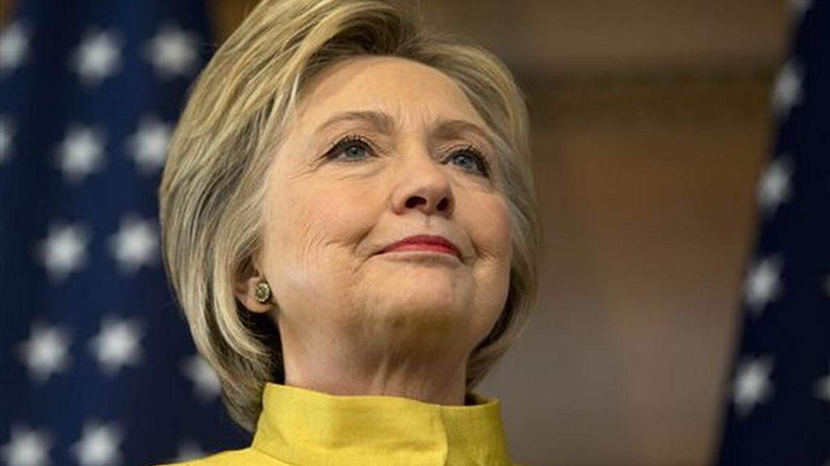 Democratic presidential candidate Hillary Clinton stands on stage as she is introduced by former U.S. Ambassador to Russia Michael McFaul to speak about counterterrorism, Wednesday, March 23, 2016, at the Bechtel Conference Center at Stanford University in Stanford, Calif.