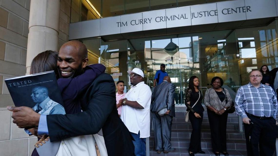Attorney Nina Morrision gets a hug from John Nolley after the hearing outside of the courthouse in Fort Worth, Texas, on May 17, 2016. In Judge Louis Sturns' 213th District Court, John Nolley, from Bedford, was released from custody after 19 years behind bars, in Fort Worth, due to efforts by The Innocence Project. Nolley had been found guilty of murder in 1998.