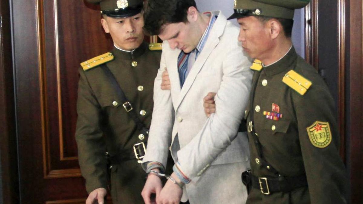 Guards escort American student Otto Warmbier at the Supreme Court in Pyongyang, North Korea on March 16, 2016. Warmbier, whose parents say has been in a coma while serving a 15-year prison term in North Korea, was released and returned to the United States on Tuesday, June 13, 2017.