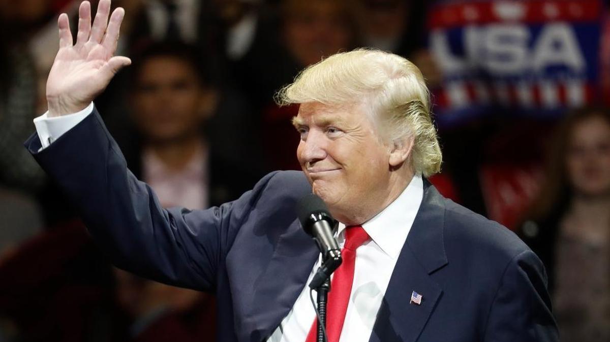 President-elect Donald Trump waves and smiles as he speaks during the first stop of his post-election tour, Thursday, Dec. 1, 2016, in Cincinnati.