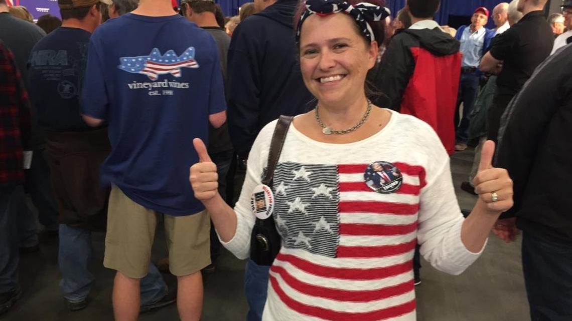 Kelly Hammer signals her support for Donald Trump at a Mike Pence rally in York, Pa., on Thursday, Sept. 29, 2016.