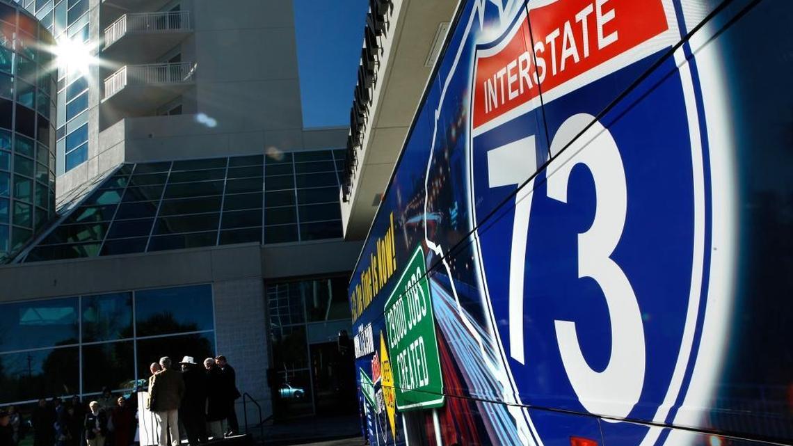 A Shrink-wrapped tour bus with Interstate 73 promos was a backdrop as Myrtle Beach area leaders gathered Friday at the Myrtle Beach Convention Center to encourage residents to be "cheerleaders" for Interstate 73 and other infrastructure projects this weekend when candidates are in town for the Republican Presidential Debate.