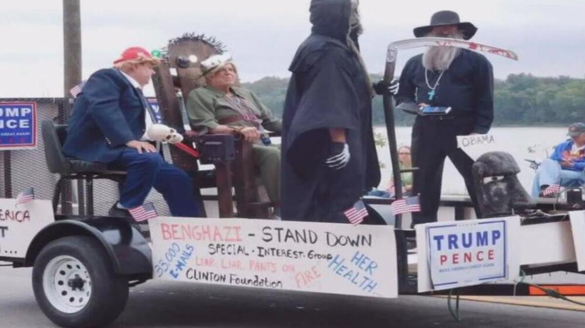 A picture shared by FOX 19 showed the float, decked out in Trump-Pence campaign signs and with Donald Trump sitting next to Hillary Clinton in an electric chair.