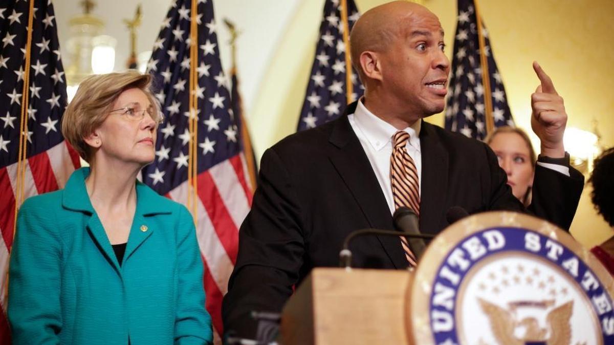 Sen. Cory Booker, D-N.J. and Sen. Elizabeth Warren, D-Mass. participate in a news conference on Capitol Hill in Washington, Tuesday, July 11, 2017, to discuss the introduction of the Dignity for Incarcerated Women Act. The bill helps address some of the unique challenges women face while in prison.