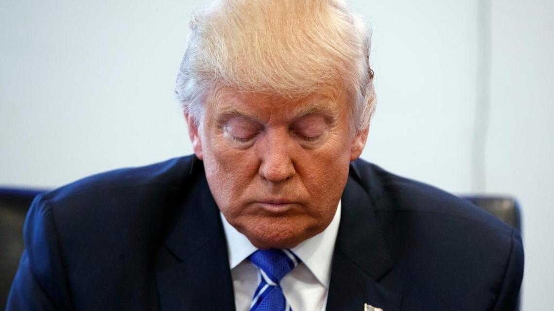 Republican presidential candidate Donald Trump pauses during a meeting with members of the National Border Patrol Council at Trump Tower, Friday, Oct. 7, 2016, in New York.