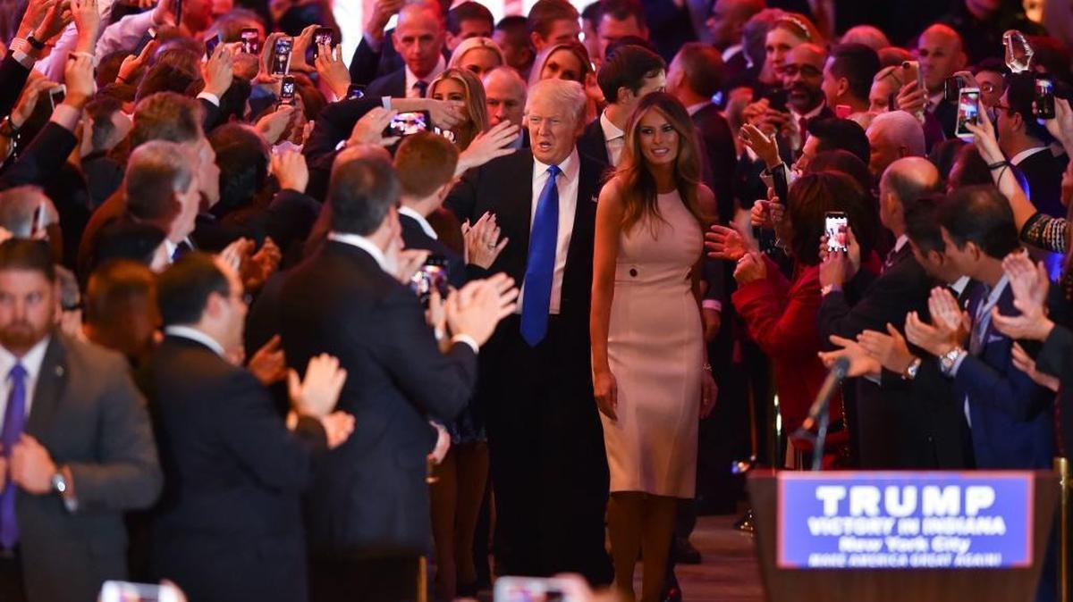 Donald Trump arrives with wife Melania to address the media at Trump Tower in New York after Tuesday's big victory in Indiana. "Who would have thought that I'd be here and we'd be waiting for Hillary?" Trump said, referring to Hillary Clinton's unfinished primary fight.