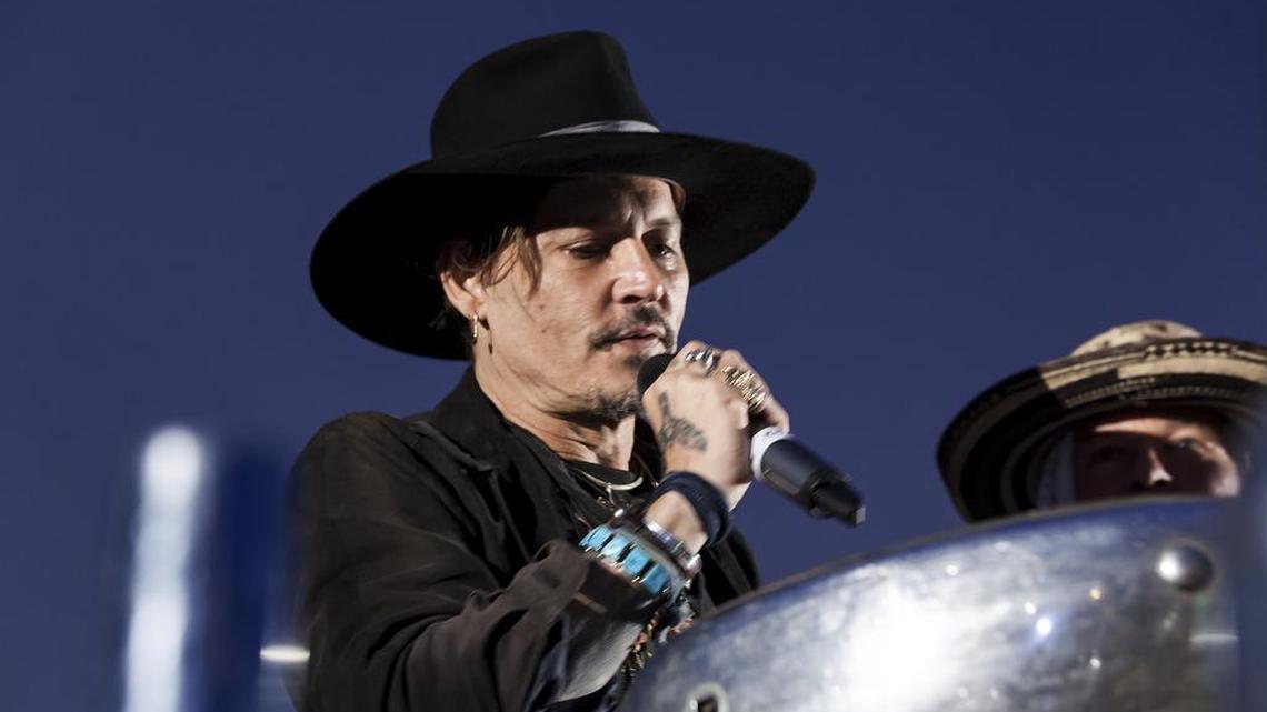 Actor Johnny Depp addresses film goers at the Glastonbury music festival at Worthy Farm, in Somerset, England, Thursday, June 22, 2017.