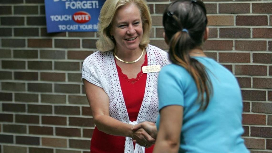 Sheri Few, left, greets voter Tamara Harvey outside the North Springs 2 Precinct at North Springs Elementary School, June 13, 2006.