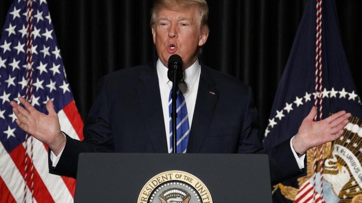 In this Feb. 8, 2017, photo, President Donald Trump speaks to the Major County Sheriffs' Association and Major Cities Chiefs Association, in Washington.Trump says it doesn’t take a lawyer to see that his order banning visitors from seven Muslim-majority nations is a “common sense” move to protect the U.S. from terrorists. He says even a bad high school student could figure that out.