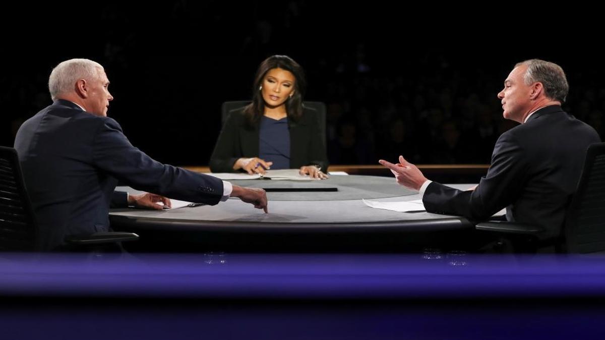 Republican vice-presidential nominee Gov. Mike Pence, left, and Democratic vice-presidential nominee Sen. Tim Kaine exchange opinions as Moderator Elaine Quijano of CBS News listens during the vice-presidential debate at Longwood University in Farmville, Va.