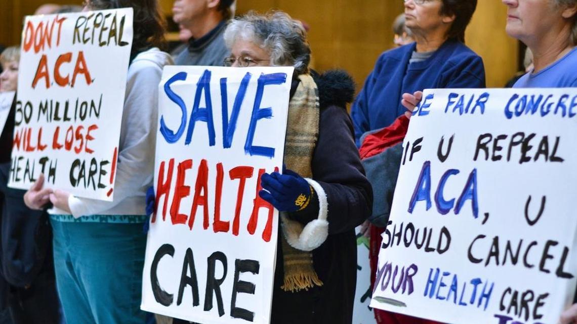 People attend a health care rally at the Indiana Statehouse in support of the Affordable Care Act, Sunday, Jan. 15, 2017, in Indianapolis. President-elect Donald Trump has vowed to overturn and replace the Affordable Care Act, and majority Republicans in Congress have begun the process of repealing it, using a budget maneuver that requires a bare majority in the Senate.