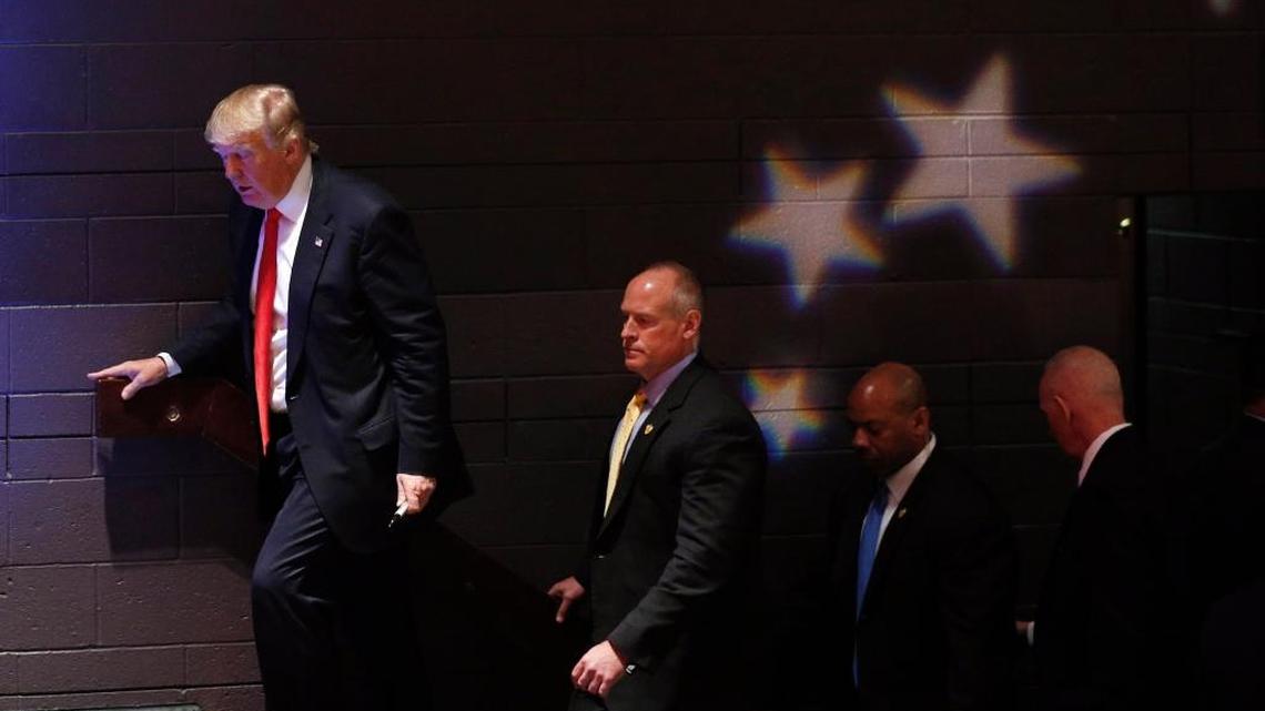 Republican presidential candidate Donald Trump leaves with Secret Service agents in tow after speaking at a campaign event at St. Norbert College in De Pere, Wisconsin, Wednesday.