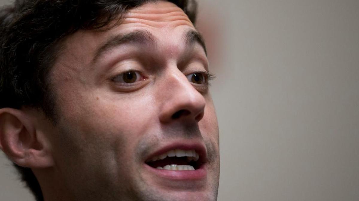 Democratic candidate for Georgia's Sixth Congressional Seat Jon Ossoff talks with reporters at a campaign field office.