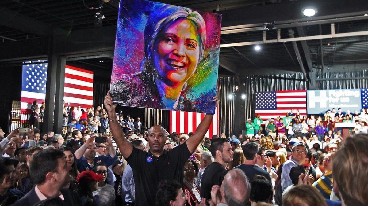 Hillary Clinton supporters cheer as Super Tuesday election results start to come in at the Ice Palace Studios in Miami on March 1.
