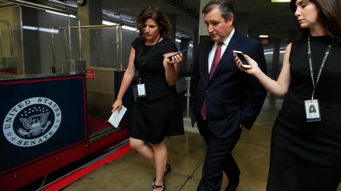 Sen. Ted Cruz, R-Texas, center, speaks to reporters on Capitol Hill in Washington.