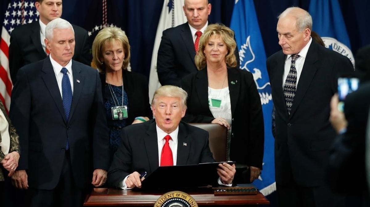 President Donald Trump, accompanied by Vice President Mike Pence, Homeland Security Secretary John F. Kelly, and others, speaks during a visit to the Homeland Security Department in Washington, Wednesday, Jan. 25, 2017.