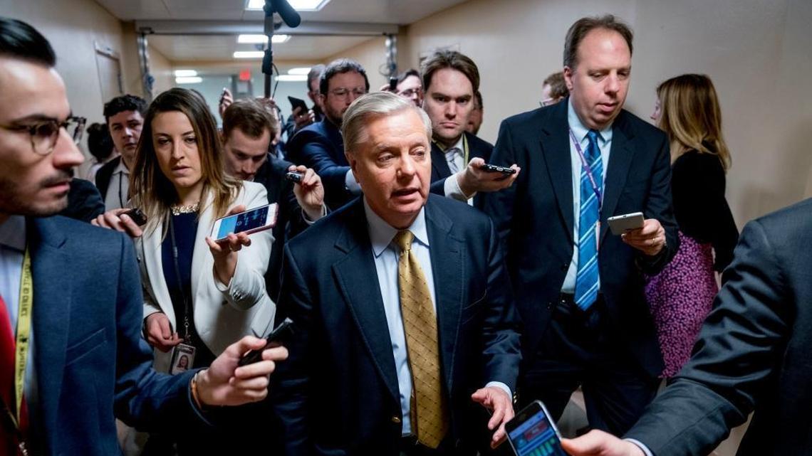 Sen. Lindsey Graham, R-S.C., speaks to reporters as he walks towards the Senate as Congress moves closer to the funding deadline to avoid a government shutdown on Capitol Hill in Washington.